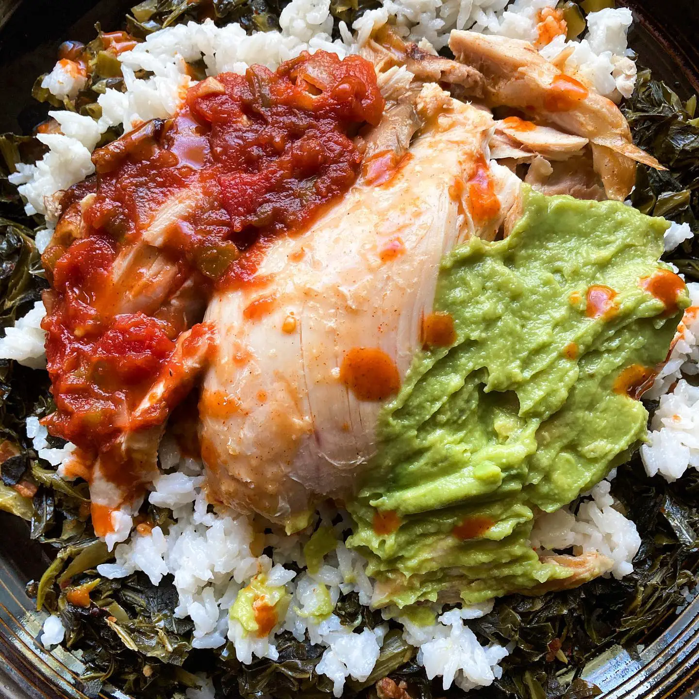 Rotisserie chicken, guacamole, and salsa over a bed of coconut rice that’s sitting on a huge helping of collard greens. It’s just a perfect lunch for me 🥙 . . . . . . . #lunchtime #rotisseriechicken #guacamole #eathealthy #eathealthyfood #deliciousfood #instayum #foodporn #foodpic #foodphotography #collardgreens #soulfood #comfortfood #blackfoodie #blackfoodbloggers #onmytable #whatsforlunch
